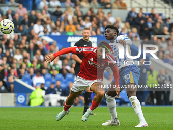 Morgan Gibbs-White of Nottingham Forest battles with Carlos Baleba of Brighton during the Premier League match between Brighton and Hove Alb...