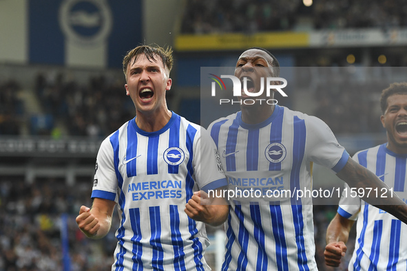 Jack Hinshelwood of Brighton celebrates with Pervis Estupinan of Brighton after scoring a goal to make it 1-1 during the Premier League matc...