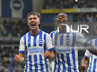 Jack Hinshelwood of Brighton celebrates with Pervis Estupinan of Brighton after scoring a goal to make it 1-1 during the Premier League matc...