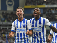 Jack Hinshelwood of Brighton celebrates with Pervis Estupinan of Brighton after scoring a goal to make it 1-1 during the Premier League matc...