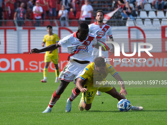 Davis Mensah of Mantova 1911 contrasts with Edoardo Masciangelo of AS Cittadella 1973 during the Italian Serie B soccer championship match b...