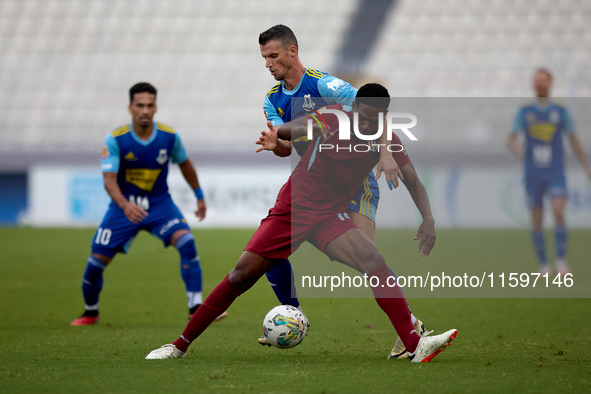 Luis Carlo Riascos of Gzira United is challenged from the back by Vito Plut of Sliema Wanderers during the Malta 360 Sports Premier League s...