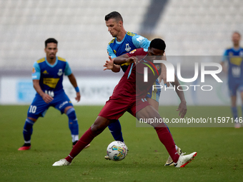 Luis Carlo Riascos of Gzira United is challenged from the back by Vito Plut of Sliema Wanderers during the Malta 360 Sports Premier League s...