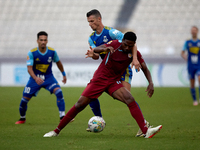 Luis Carlo Riascos of Gzira United is challenged from the back by Vito Plut of Sliema Wanderers during the Malta 360 Sports Premier League s...