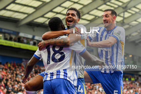 Georginio Rutter of Brighton and Lewis Dunk of Brighton celebrate after Danny Welbeck of Brighton scores a goal to make it 2-1 during the Pr...