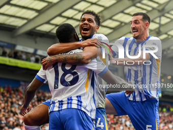 Georginio Rutter of Brighton and Lewis Dunk of Brighton celebrate after Danny Welbeck of Brighton scores a goal to make it 2-1 during the Pr...