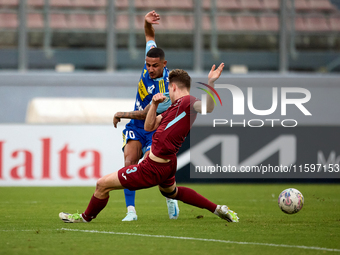 Stephen Pisani of Sliema Wanderers is challenged for the ball by Gabriel Bohrer Mentz of Gzira United during the Malta 360 Sports Premier Le...