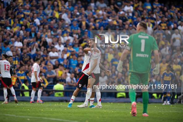 River Plate players celebrate after their team defeats Boca Juniors in an Argentine soccer league match at La Bombonera stadium in Buenos Ai...