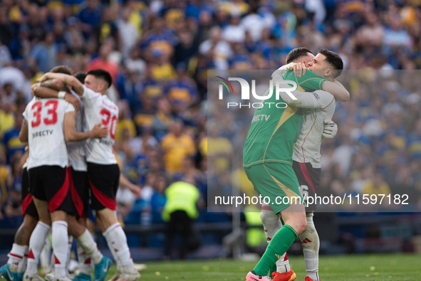 River Plate players celebrate after their team defeats Boca Juniors in an Argentine soccer league match at La Bombonera stadium in Buenos Ai...