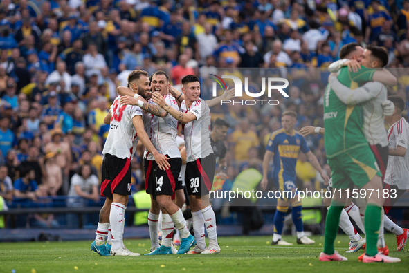 River Plate players celebrate after their team defeats Boca Juniors in an Argentine soccer league match at La Bombonera stadium in Buenos Ai...