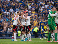 River Plate players celebrate after their team defeats Boca Juniors in an Argentine soccer league match at La Bombonera stadium in Buenos Ai...