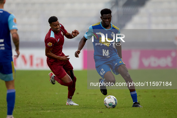 Thaylor Aldama of Gzira United closely follows Simon Zibo of Sliema Wanderers during the Malta 360 Sports Premier League soccer match betwee...