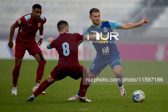 Jean Borg (R) of Sliema Wanderers competes for the ball with Zachary Scerri (C) of Gzira United during the Malta 360 Sports Premier League s...