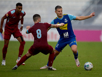 Jean Borg (R) of Sliema Wanderers competes for the ball with Zachary Scerri (C) of Gzira United during the Malta 360 Sports Premier League s...