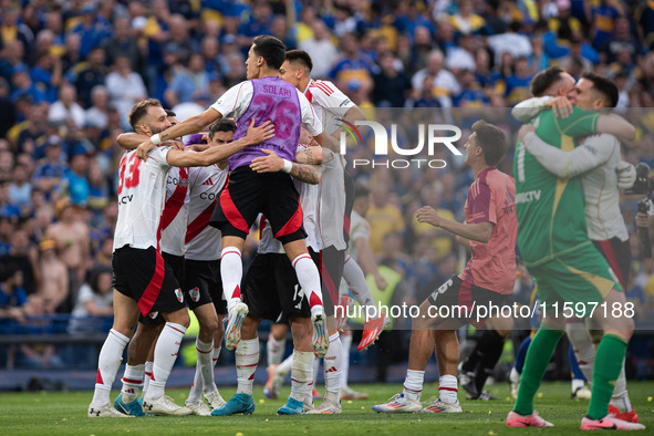 River Plate players celebrate after their team defeats Boca Juniors in an Argentine soccer league match at La Bombonera stadium in Buenos Ai...