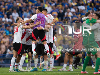 River Plate players celebrate after their team defeats Boca Juniors in an Argentine soccer league match at La Bombonera stadium in Buenos Ai...