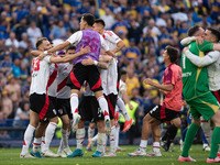 River Plate players celebrate after their team defeats Boca Juniors in an Argentine soccer league match at La Bombonera stadium in Buenos Ai...