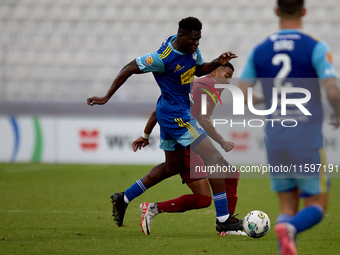 Thaylor Aldama of Gzira United vies for the ball with Simon Zibo of Sliema Wanderers during the Malta 360 Sports Premier League soccer match...