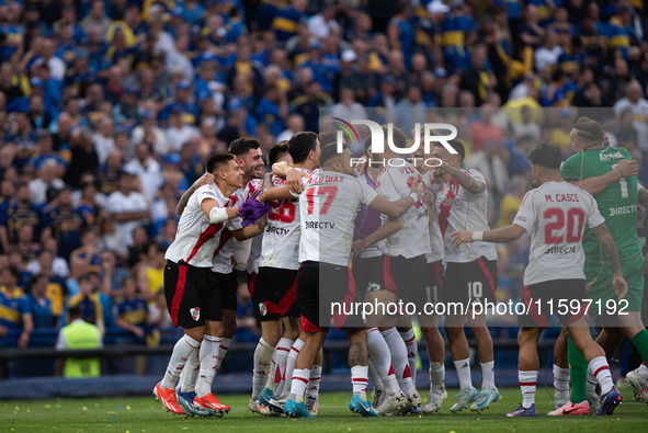 River Plate players celebrate after their team defeats Boca Juniors in an Argentine soccer league match at La Bombonera stadium in Buenos Ai...