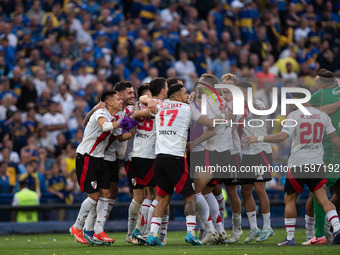 River Plate players celebrate after their team defeats Boca Juniors in an Argentine soccer league match at La Bombonera stadium in Buenos Ai...