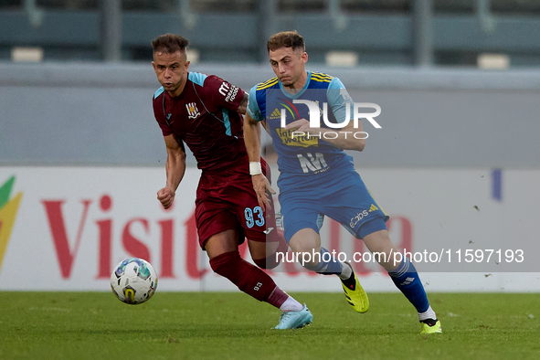 Adam Magri Overend (R) of Sliema Wanderers is followed by Thiago Espindola de Paula (L) of Gzira United during the Malta 360 Sports Premier...