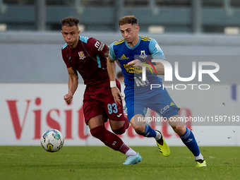 Adam Magri Overend (R) of Sliema Wanderers is followed by Thiago Espindola de Paula (L) of Gzira United during the Malta 360 Sports Premier...