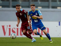 Adam Magri Overend (R) of Sliema Wanderers is followed by Thiago Espindola de Paula (L) of Gzira United during the Malta 360 Sports Premier...