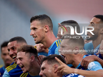 Vito Plut of Sliema Wanderers gestures in celebration with his teammates after scoring the 0-1 goal during the Malta 360 Sports Premier Leag...