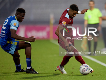 Thaylor Aldama of Gzira United is closely followed by Simon Zibo of Sliema Wanderers during the Malta 360 Sports Premier League soccer match...