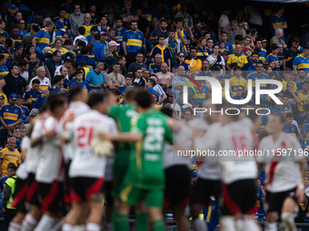 River Plate players celebrate after their team defeats Boca Juniors in an Argentine soccer league match at La Bombonera stadium in Buenos Ai...