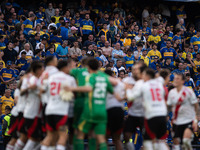 River Plate players celebrate after their team defeats Boca Juniors in an Argentine soccer league match at La Bombonera stadium in Buenos Ai...