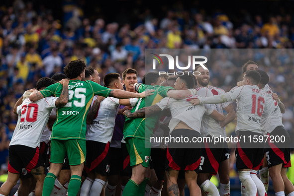 River Plate players celebrate after their team defeats Boca Juniors in an Argentine soccer league match at La Bombonera stadium in Buenos Ai...