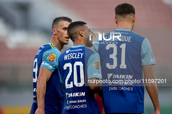 Vito Plut of Sliema Wanderers gestures in celebration with his teammates after scoring the 0-1 goal during the Malta 360 Sports Premier Leag...