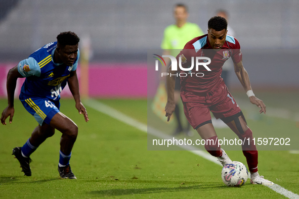 Thaylor Aldama of Gzira United is closely followed by Simon Zibo of Sliema Wanderers during the Malta 360 Sports Premier League soccer match...