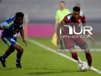 Thaylor Aldama of Gzira United is closely followed by Simon Zibo of Sliema Wanderers during the Malta 360 Sports Premier League soccer match...