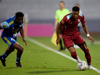 Thaylor Aldama of Gzira United is closely followed by Simon Zibo of Sliema Wanderers during the Malta 360 Sports Premier League soccer match...