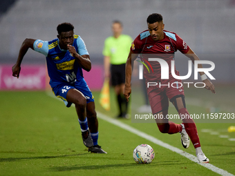 Thaylor Aldama of Gzira United is closely followed by Simon Zibo of Sliema Wanderers during the Malta 360 Sports Premier League soccer match...