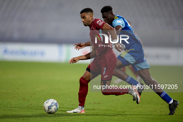 Thaylor Aldama of Gzira United is closely followed by Simon Zibo of Sliema Wanderers during the Malta 360 Sports Premier League soccer match...