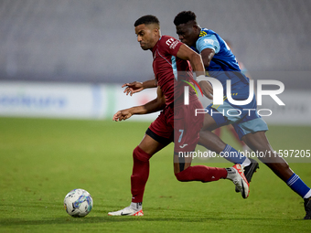 Thaylor Aldama of Gzira United is closely followed by Simon Zibo of Sliema Wanderers during the Malta 360 Sports Premier League soccer match...