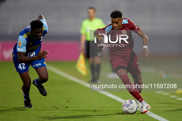 Thaylor Aldama of Gzira United is closely followed by Simon Zibo of Sliema Wanderers during the Malta 360 Sports Premier League soccer match...