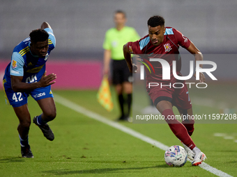 Thaylor Aldama of Gzira United is closely followed by Simon Zibo of Sliema Wanderers during the Malta 360 Sports Premier League soccer match...