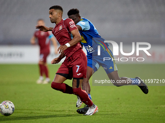 Thaylor Aldama of Gzira United is closely followed by Simon Zibo of Sliema Wanderers during the Malta 360 Sports Premier League soccer match...