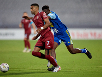 Thaylor Aldama of Gzira United is closely followed by Simon Zibo of Sliema Wanderers during the Malta 360 Sports Premier League soccer match...