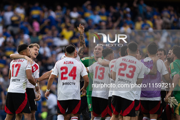 River Plate players celebrate after their team defeats Boca Juniors in an Argentine soccer league match at La Bombonera stadium in Buenos Ai...