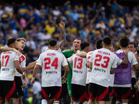 River Plate players celebrate after their team defeats Boca Juniors in an Argentine soccer league match at La Bombonera stadium in Buenos Ai...