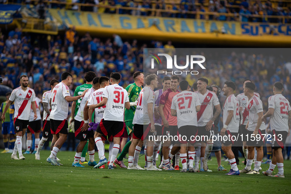 River Plate players celebrate after their team defeats Boca Juniors in an Argentine soccer league match at La Bombonera stadium in Buenos Ai...