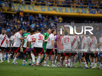 River Plate players celebrate after their team defeats Boca Juniors in an Argentine soccer league match at La Bombonera stadium in Buenos Ai...