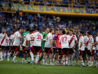 River Plate players celebrate after their team defeats Boca Juniors in an Argentine soccer league match at La Bombonera stadium in Buenos Ai...