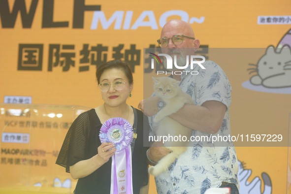 Purebred cats compete at the 2024 Hangzhou International Purebred Cat Tasting Competition in Hangzhou, China, on September 22, 2024. 