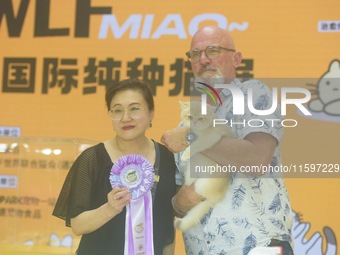 Purebred cats compete at the 2024 Hangzhou International Purebred Cat Tasting Competition in Hangzhou, China, on September 22, 2024. (